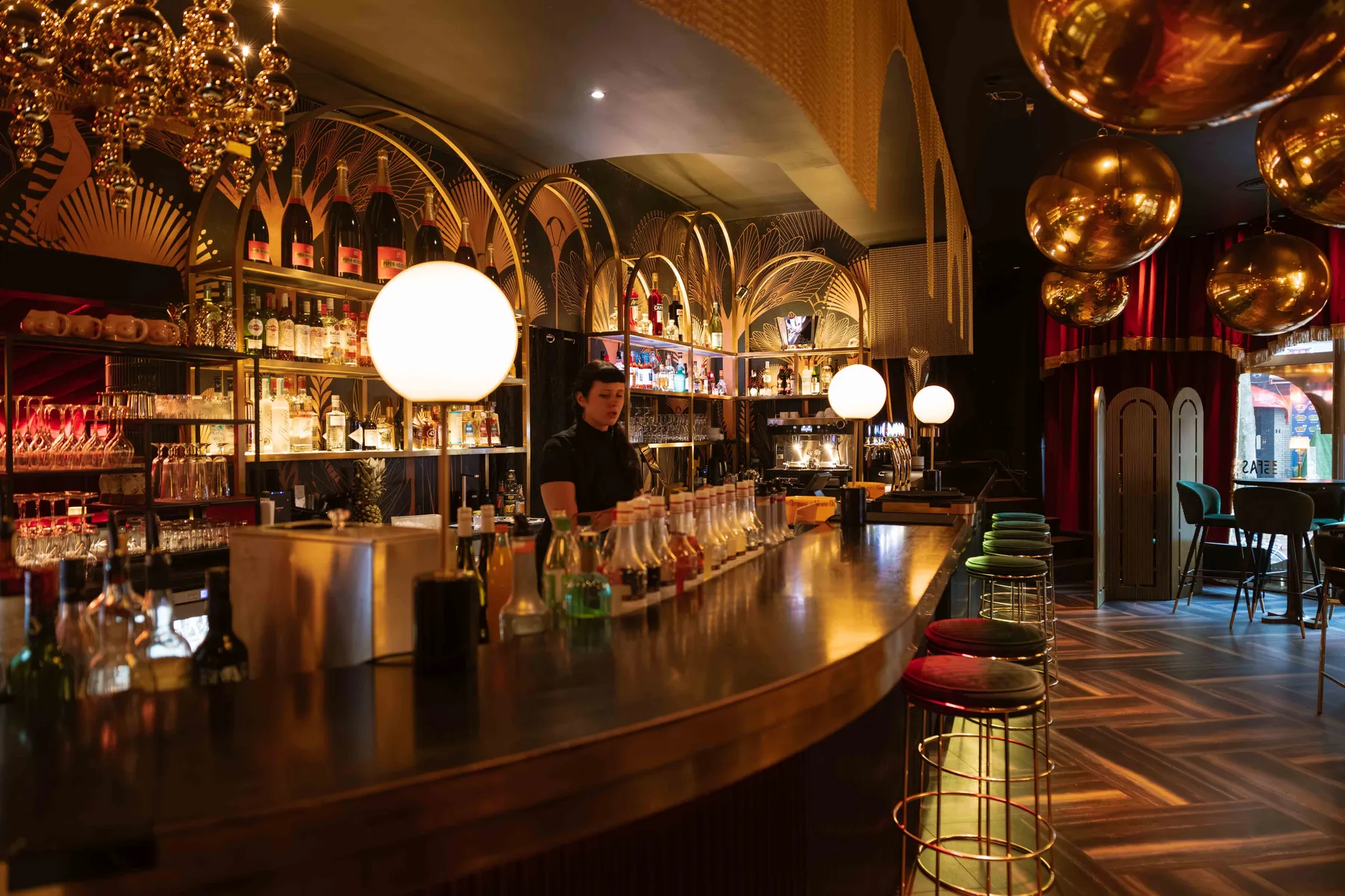 The UnFassBar with brass arches and chandeliers